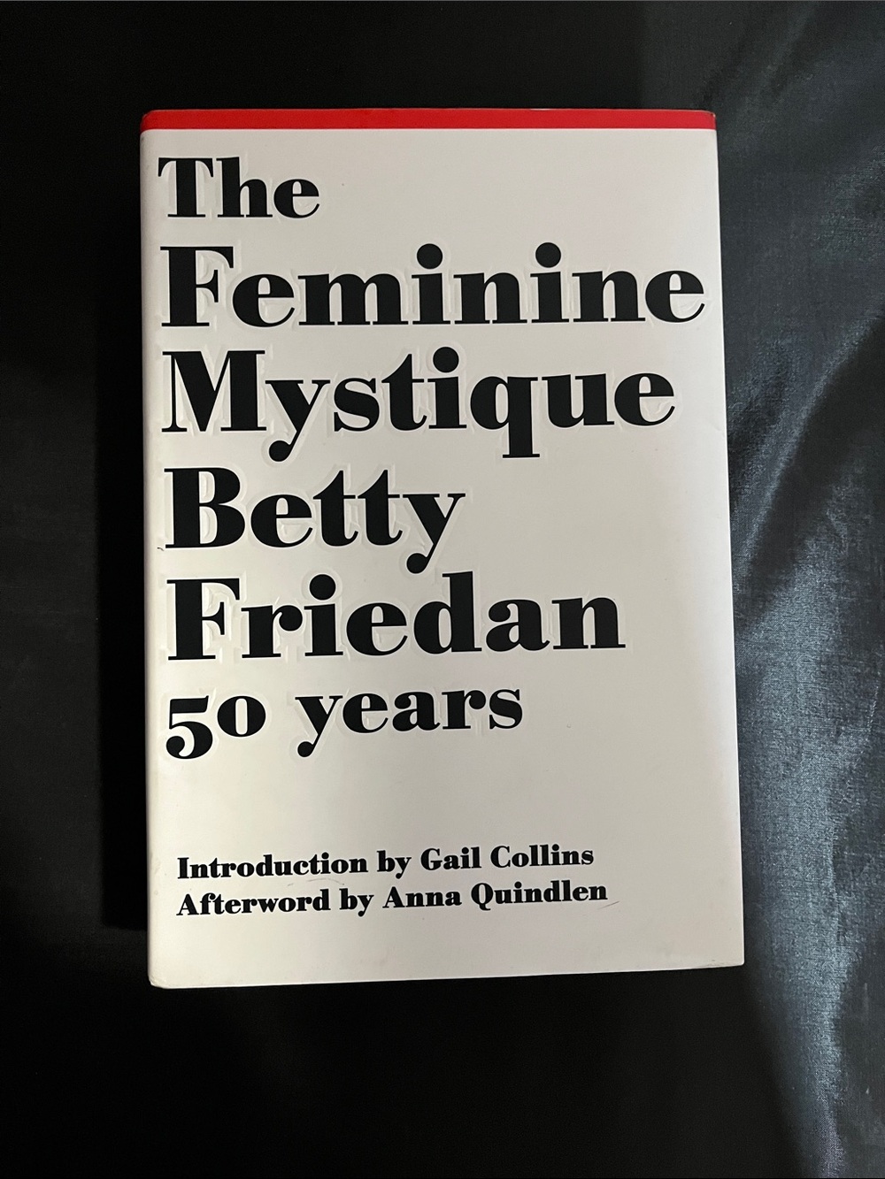 The Feminine Mystique by Betty Friedan - White & Black Cover